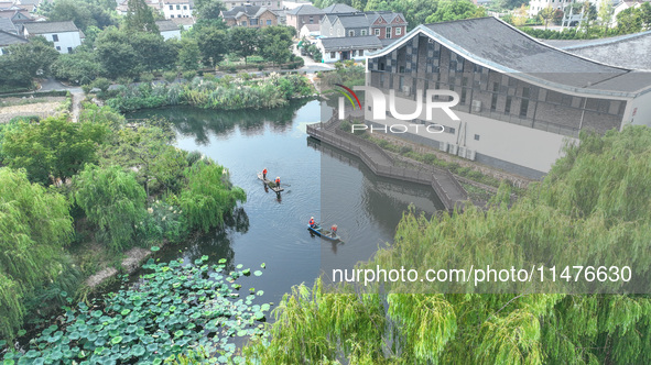 River cleaners are performing daily cleaning at Miaoqiantou River in Dongheng Village, Huzhou City, East China's Zhejiang Province, on Augus...