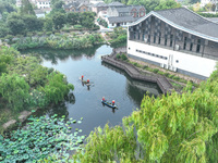 River cleaners are performing daily cleaning at Miaoqiantou River in Dongheng Village, Huzhou City, East China's Zhejiang Province, on Augus...