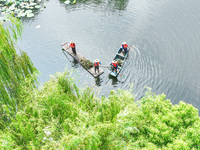 River cleaners are performing daily cleaning at Miaoqiantou River in Dongheng Village, Huzhou City, East China's Zhejiang Province, on Augus...