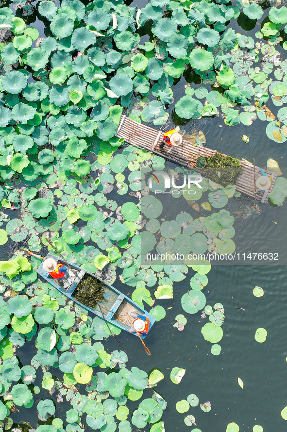 River cleaners are performing daily cleaning at Miaoqiantou River in Dongheng Village, Huzhou City, East China's Zhejiang Province, on Augus...