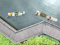 River cleaners are performing daily cleaning at Miaoqiantou River in Dongheng Village, Huzhou City, East China's Zhejiang Province, on Augus...