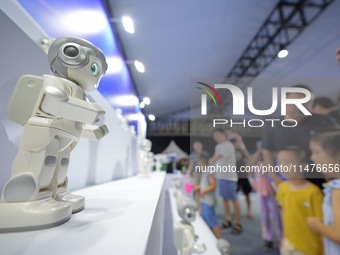 Children are watching a humanoid robot at a science popularization event in Yantai, China, on August 13, 2024. International investment bank...