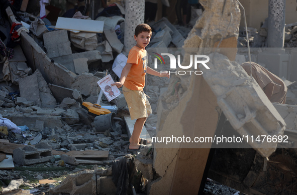 Palestinians are inspecting the rubble following overnight Israeli bombardment which is hitting the Abu Nada family home at the Nuseirat ref...