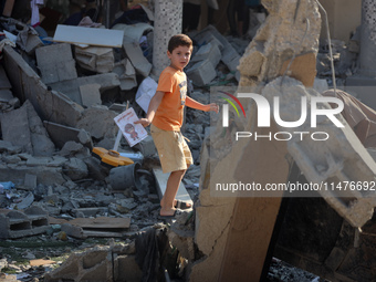 Palestinians are inspecting the rubble following overnight Israeli bombardment which is hitting the Abu Nada family home at the Nuseirat ref...