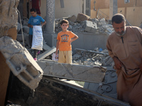 Palestinians are inspecting the rubble following overnight Israeli bombardment which is hitting the Abu Nada family home at the Nuseirat ref...