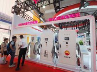 Visitors are visiting the ''480KW flexible charging Pile'' at the 2024 Beijing International Charging Pile and Power Station Exhibition in B...