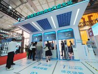 Visitors are visiting the ''Optical Storage, Charge and Discharge Microgrid Overcharge Station'' at the 2024 Beijing International Charging...