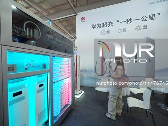 Visitors are visiting the ''Huawei Liquid Cooled Supercharge'' at the 2024 Beijing International Charging Pile and Power Station Exhibition...