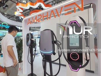 Visitors are visiting the ''Smart Charging Pile'' at the 2024 Beijing International Charging Pile and Power Station Exhibition in Beijing, C...