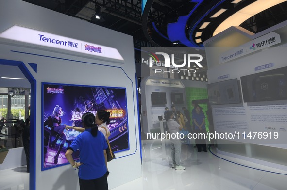 Visitors are visiting the stand of Tencent at the World Artificial Intelligence Conference 2024 in Shanghai, China, on July 4, 2024. On Augu...