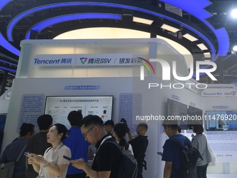 Visitors are visiting the stand of Tencent at the World Artificial Intelligence Conference 2024 in Shanghai, China, on July 4, 2024. On Augu...