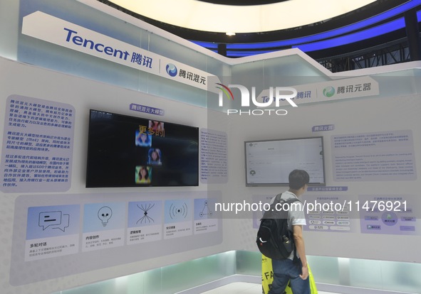 Visitors are visiting the stand of Tencent at the World Artificial Intelligence Conference 2024 in Shanghai, China, on July 4, 2024. On Augu...