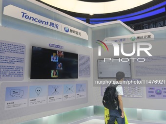 Visitors are visiting the stand of Tencent at the World Artificial Intelligence Conference 2024 in Shanghai, China, on July 4, 2024. On Augu...