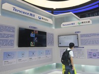 Visitors are visiting the stand of Tencent at the World Artificial Intelligence Conference 2024 in Shanghai, China, on July 4, 2024. On Augu...