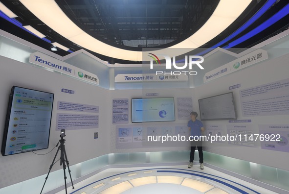 Visitors are visiting the stand of Tencent at the World Artificial Intelligence Conference 2024 in Shanghai, China, on July 4, 2024. On Augu...