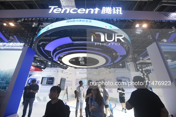 Visitors are visiting the stand of Tencent at the World Artificial Intelligence Conference 2024 in Shanghai, China, on July 4, 2024. On Augu...