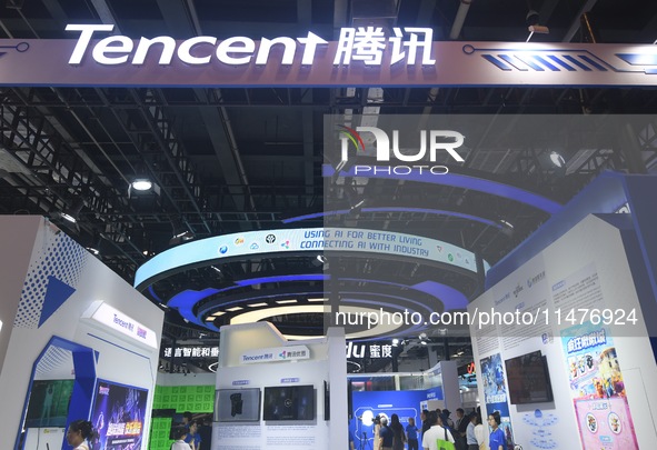 Visitors are visiting the stand of Tencent at the World Artificial Intelligence Conference 2024 in Shanghai, China, on July 4, 2024. On Augu...