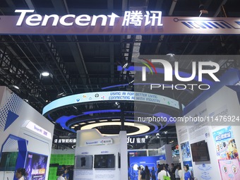 Visitors are visiting the stand of Tencent at the World Artificial Intelligence Conference 2024 in Shanghai, China, on July 4, 2024. On Augu...