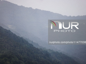 A general view of the mountains is showing rain in Bergamo, Italy, on August 13, 2024 (