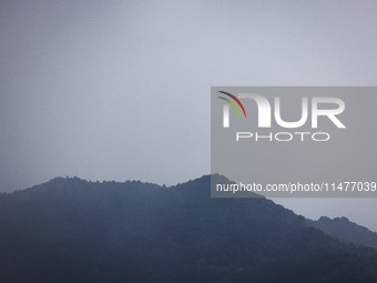 A general view of the mountains is showing rain in Bergamo, Italy, on August 13, 2024 (