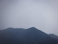 A general view of the mountains is showing rain in Bergamo, Italy, on August 13, 2024 (