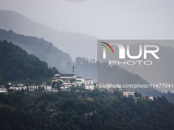 A general view of the mountains is showing rain in Bergamo, Italy, on August 13, 2024 (