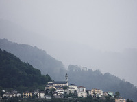 A general view of the mountains is showing rain in Bergamo, Italy, on August 13, 2024 (