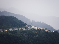 A general view of the mountains is showing rain in Bergamo, Italy, on August 13, 2024 (