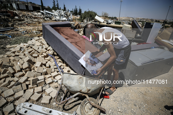 Commercial structures and animal shelters in the area are being demolished as Israeli forces conduct a raid in the At-Tur neighborhood of Ea...