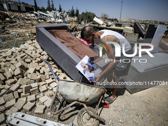 Commercial structures and animal shelters in the area are being demolished as Israeli forces conduct a raid in the At-Tur neighborhood of Ea...