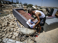 Commercial structures and animal shelters in the area are being demolished as Israeli forces conduct a raid in the At-Tur neighborhood of Ea...