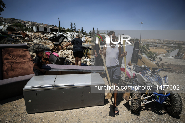 Commercial structures and animal shelters in the area are being demolished as Israeli forces conduct a raid in the At-Tur neighborhood of Ea...