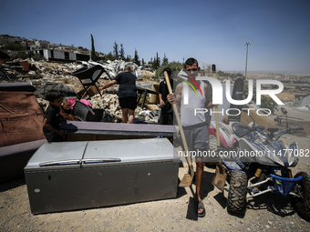 Commercial structures and animal shelters in the area are being demolished as Israeli forces conduct a raid in the At-Tur neighborhood of Ea...