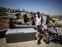 Commercial structures and animal shelters in the area are being demolished as Israeli forces conduct a raid in the At-Tur neighborhood of Ea...