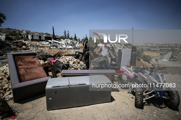 Commercial structures and animal shelters in the area are being demolished as Israeli forces conduct a raid in the At-Tur neighborhood of Ea...