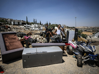 Commercial structures and animal shelters in the area are being demolished as Israeli forces conduct a raid in the At-Tur neighborhood of Ea...