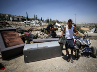 Commercial structures and animal shelters in the area are being demolished as Israeli forces conduct a raid in the At-Tur neighborhood of Ea...