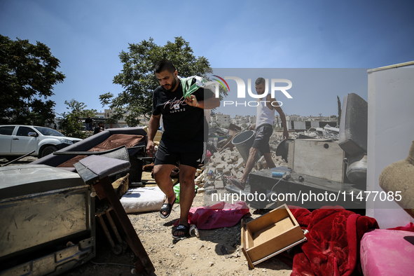 Commercial structures and animal shelters in the area are being demolished as Israeli forces conduct a raid in the At-Tur neighborhood of Ea...