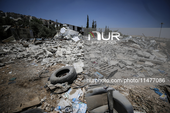 Commercial structures and animal shelters in the area are being demolished as Israeli forces conduct a raid in the At-Tur neighborhood of Ea...