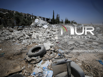 Commercial structures and animal shelters in the area are being demolished as Israeli forces conduct a raid in the At-Tur neighborhood of Ea...