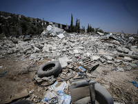 Commercial structures and animal shelters in the area are being demolished as Israeli forces conduct a raid in the At-Tur neighborhood of Ea...