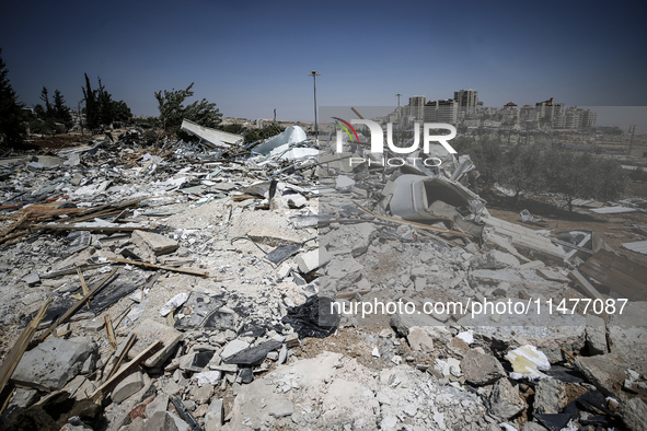 Commercial structures and animal shelters in the area are being demolished as Israeli forces conduct a raid in the At-Tur neighborhood of Ea...