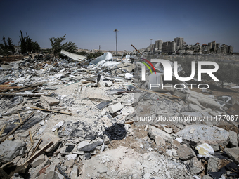 Commercial structures and animal shelters in the area are being demolished as Israeli forces conduct a raid in the At-Tur neighborhood of Ea...