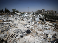 Commercial structures and animal shelters in the area are being demolished as Israeli forces conduct a raid in the At-Tur neighborhood of Ea...