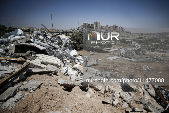 Commercial structures and animal shelters in the area are being demolished as Israeli forces conduct a raid in the At-Tur neighborhood of Ea...