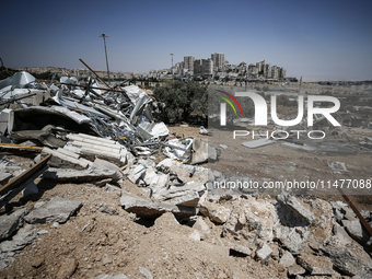 Commercial structures and animal shelters in the area are being demolished as Israeli forces conduct a raid in the At-Tur neighborhood of Ea...