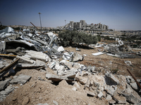 Commercial structures and animal shelters in the area are being demolished as Israeli forces conduct a raid in the At-Tur neighborhood of Ea...