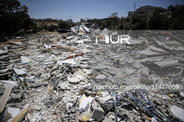 Commercial structures and animal shelters in the area are being demolished as Israeli forces conduct a raid in the At-Tur neighborhood of Ea...