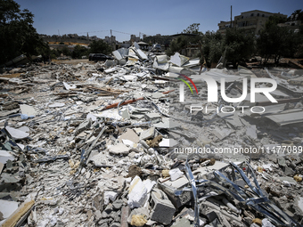 Commercial structures and animal shelters in the area are being demolished as Israeli forces conduct a raid in the At-Tur neighborhood of Ea...