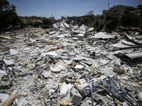 Commercial structures and animal shelters in the area are being demolished as Israeli forces conduct a raid in the At-Tur neighborhood of Ea...